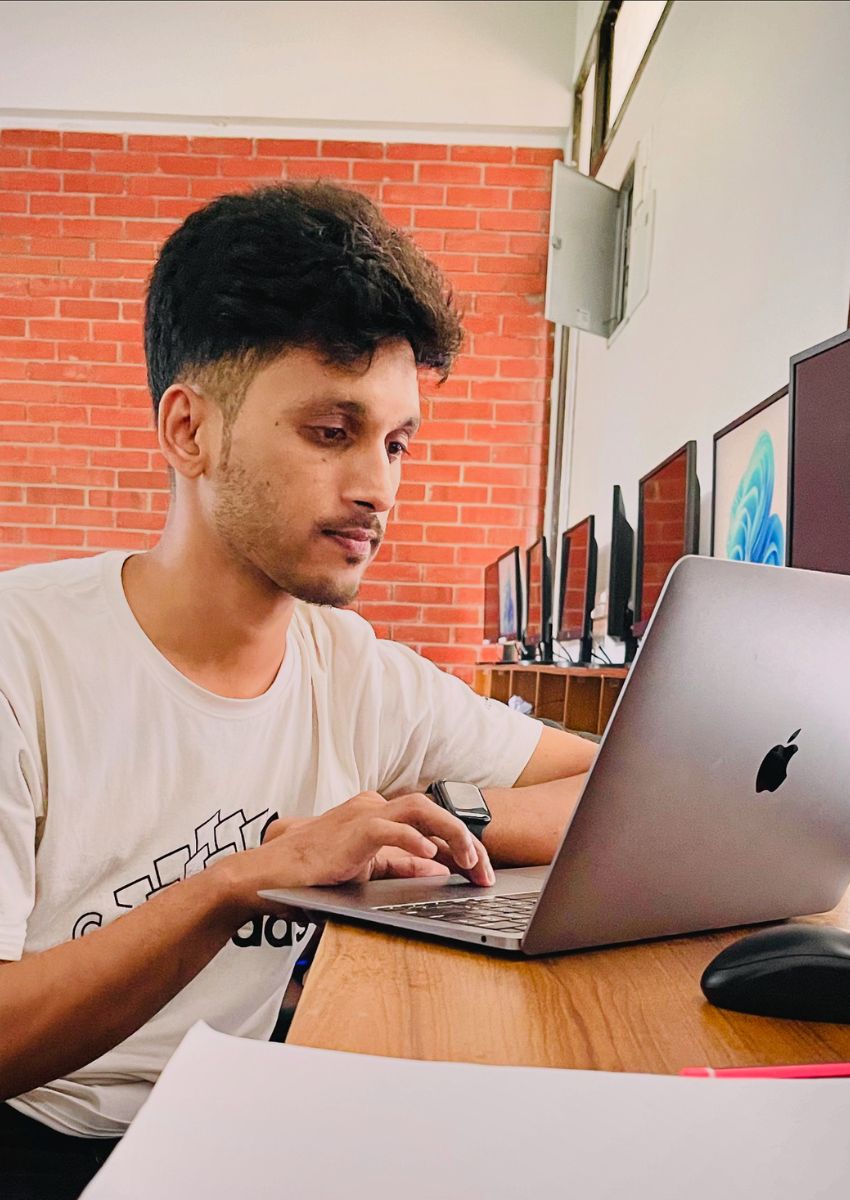 dipto nath working with laptop